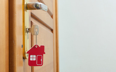 A key in a lock with house icon on it