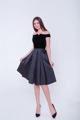 Beauty brunette model woman in evening dress. Beautiful fashion luxury makeup and hairstyle. Seductive girl silhouette on white background.