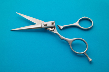 Broken scissors. Broken barber scissors. Old scissors