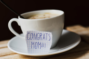 text congrats mom in a piece of paper