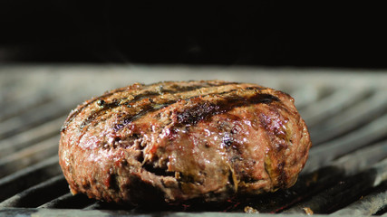 cooking burgers big cutlet on hot grill with flames