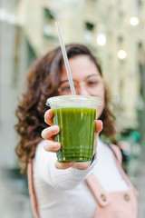 Fototapeta premium Girl with a takeaway plastic drink.