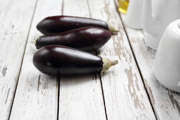 Eggplants, ripe vegetables on a wooden table.