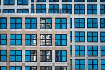 Fototapeta na wymiar Historic building reflection in window glass facade, Gendarmentmarkt