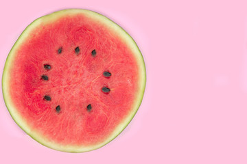 fresh watermelon on pink background. sweet summer fruit.