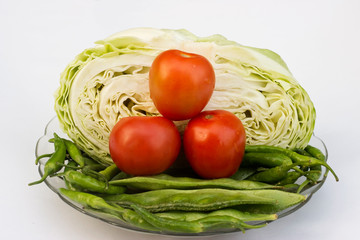 Close up on Fresh cabbage , beans, Green Chilli and Cherry tomato Organic vegetable background in freshness atmosphere