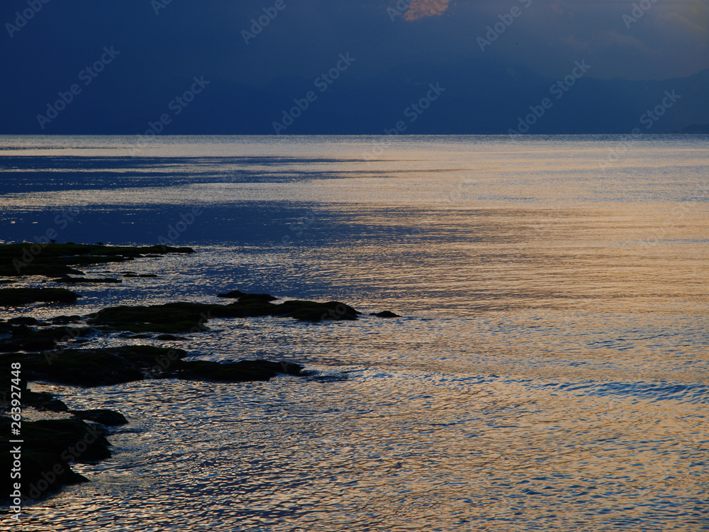 Wall mural blue sky and sea at sunset