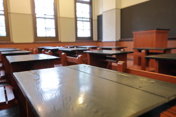 Empty class room with desk chair blackboard
