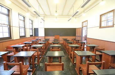 Empty class room with desk chair blackboard