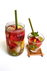 infused water in glass on white background