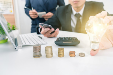 business hand showing creative business strategy with light bulb as concept holding light bulb, new idea