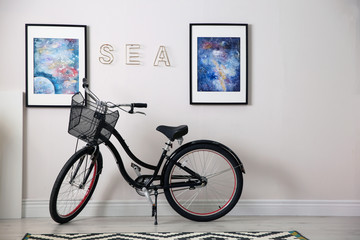 Stylish room interior with modern bicycle. Space for text