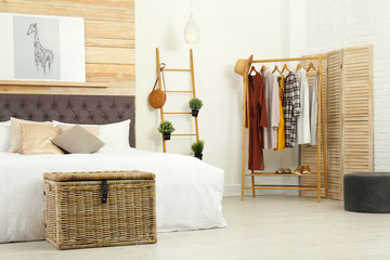 Stylish room interior with comfortable double bed