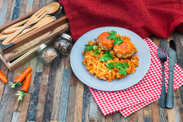 stuffed tomatoes with rice on a white plate