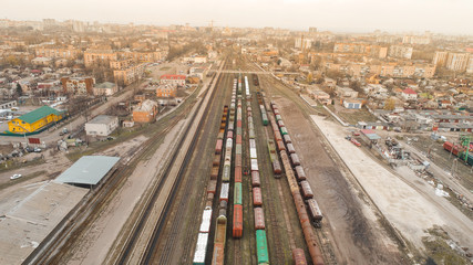 Obraz premium aerial view of city with trains on railway station sun time city 