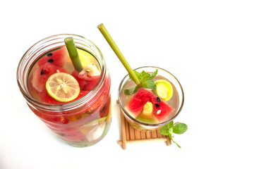 infused water in glass on white background