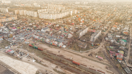 aerial view of city with trains on railway station sun time city 