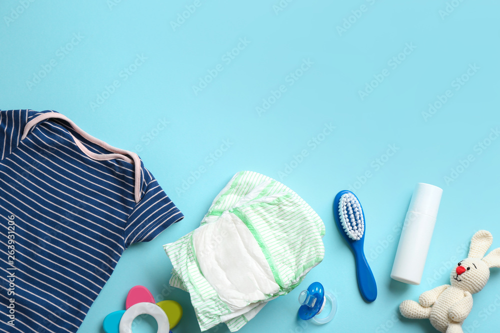 Wall mural flat lay composition with baby accessories and space for text on color background