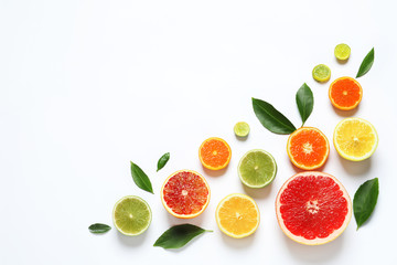 Fototapeta na wymiar Flat lay composition with different citrus fruits on white background