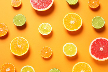 Different citrus fruits on color background, flat lay