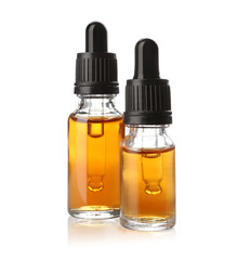 Bottles of essential oil isolated on white