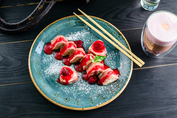 Dessert Maki Sushi - Roll with Various Fruit and Cream Cheese inside. Pancake outside. Served with Strawberries Sauce © smspsy