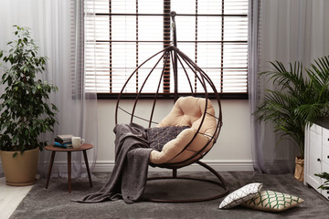 Stylish modern room interior with swing chair