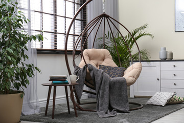 Stylish modern room interior with swing chair