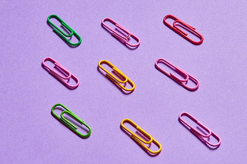 fooling around with paper clips, having fun with colorful clips , top view photo