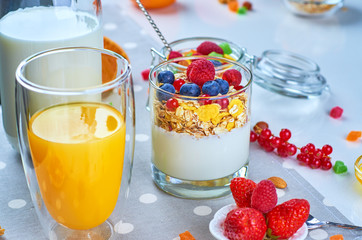 Healthy breakfast with muesli, milk, yogurt, fruit