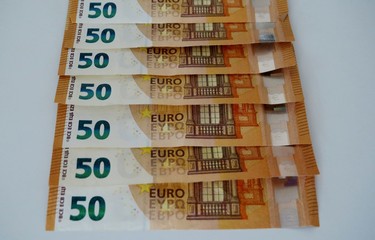 fifty euro banknotes on a white background close-up