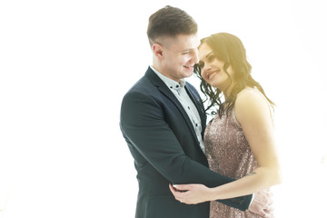 Young happy couple in white interior 