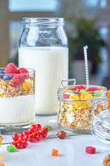Healthy breakfast with muesli, milk, yogurt, fruit