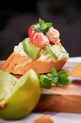 Delicious snacks with shrimp, fish and avocado