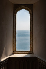 window on the wall overlooking the sea
