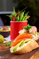 Delicious snacks with shrimp, fish and avocado