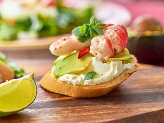 Delicious snacks with shrimp, fish and avocado