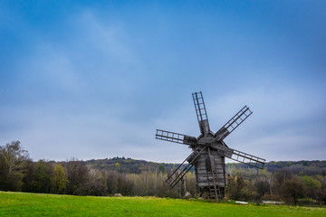 Fototapeta na wymiar windmill in the field at spring