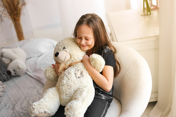 little girl with teddy bear