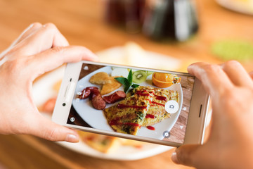 taking photo at breakfast