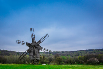 Fototapeta na wymiar old windmill in a field