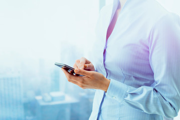 Corporate business executive connecting with a smartphone