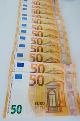  fifty euro banknotes on a white background close-up