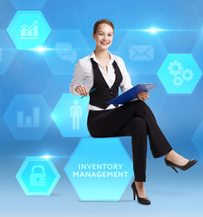 The concept of business, technology, the Internet and the network. A young entrepreneur working on a virtual screen of the future and sees the inscription: Inventory management