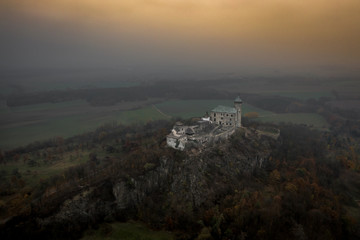 Fototapeta premium Kunětice Mountain sits in a plain, above which it rises 82 meters (305 m above sea level). Geologically, the mountain is a laccolith, dating from the Cenozoic era. Toward the end of the 19th century.