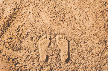 Footprints on the beach sand