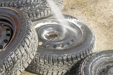 removed from the car wheels are washed with a high pressure sink