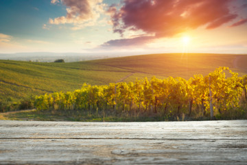 empty wooden table and Tuscan landscape at sunrise