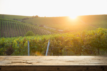 empty wooden table and Tuscan landscape at sunrise