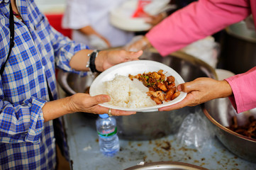 People who are rich and mentally assisting people in society, sharing food for the hungry : Help and Donation Concepts